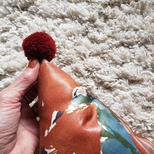 Abstract Rust Floral PomPom Triangle Pillow
