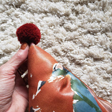 Load image into Gallery viewer, Abstract Rust Floral PomPom Triangle Pillow
